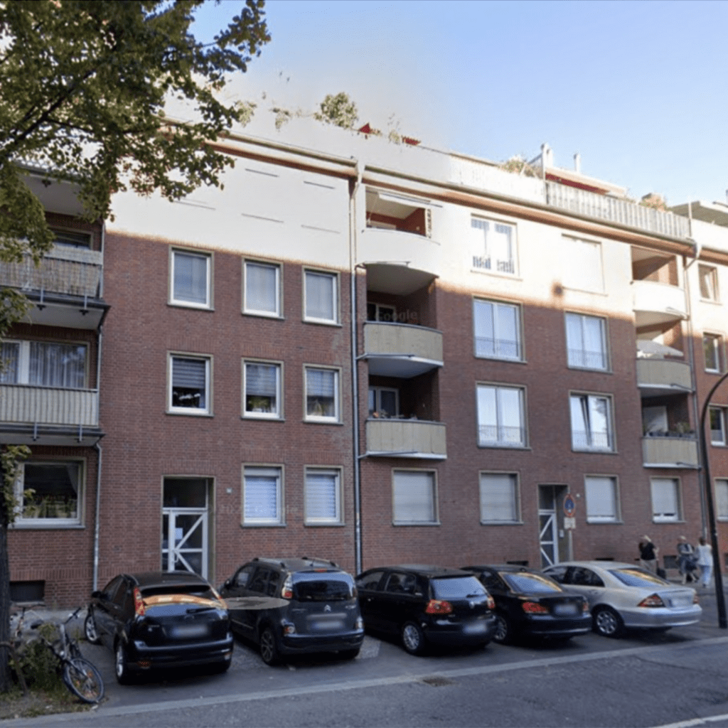 a building with cars parked in front of it