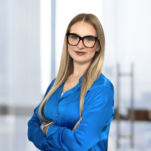 a woman with glasses and blue shirt