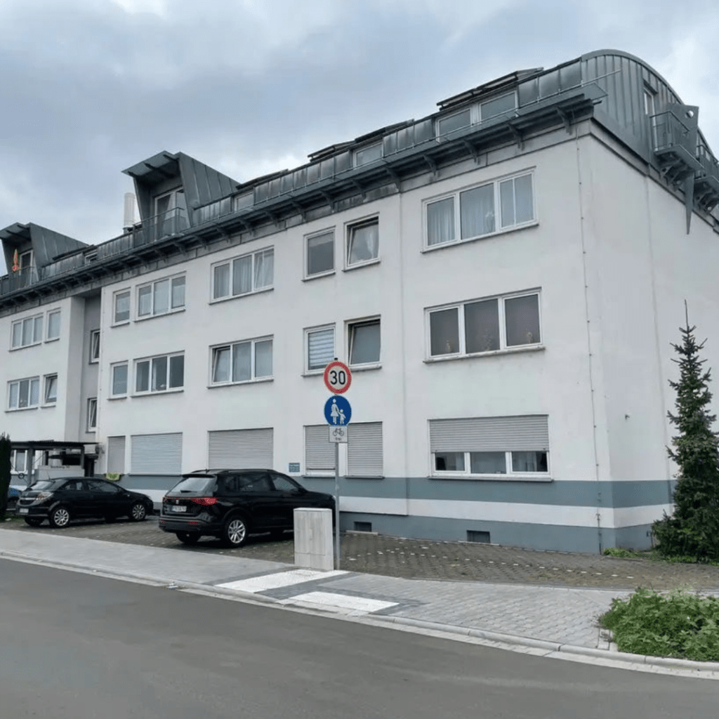 a building with cars parked in front of it
