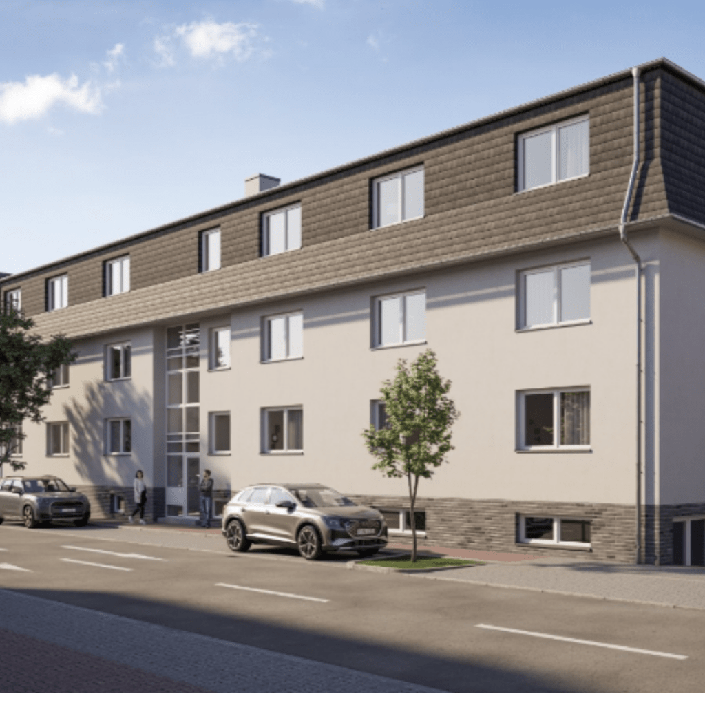 a building with cars parked on the side of the road