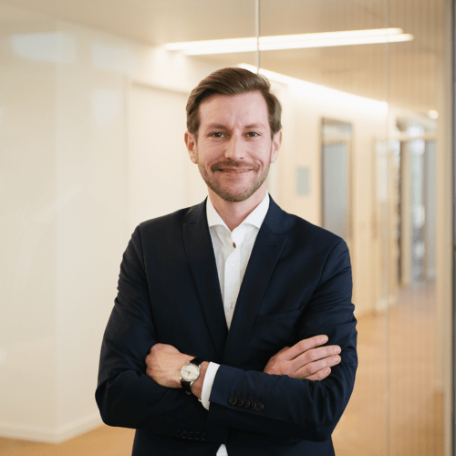 Jan Brockschläger a man in a suit with his arms crossed