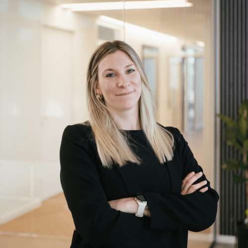 Nathalie Seiler a woman in a suit with her arms crossed