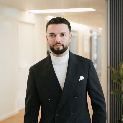 Noah Mayer a man in a black suit